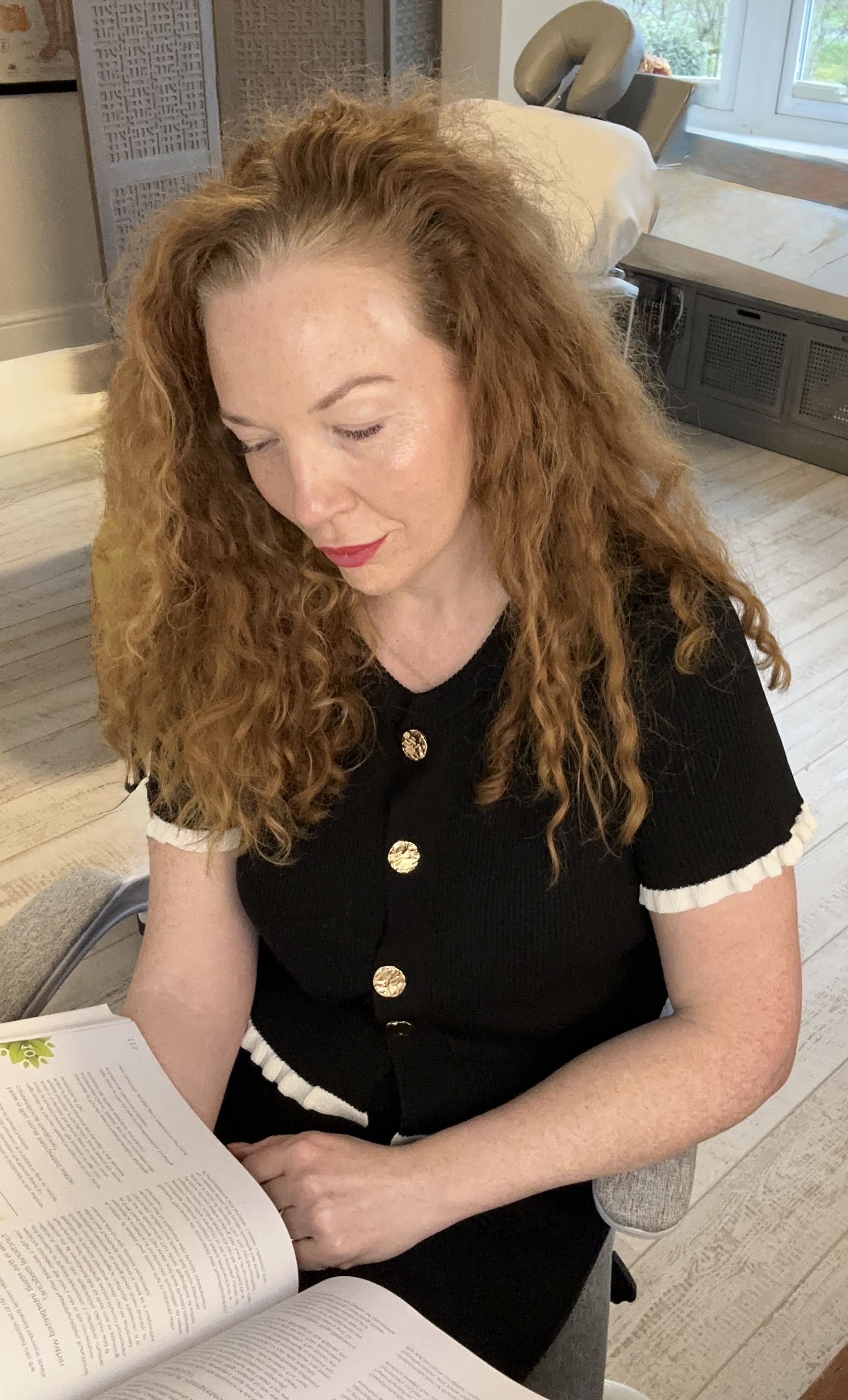 Siân Sayers reading in her clinic